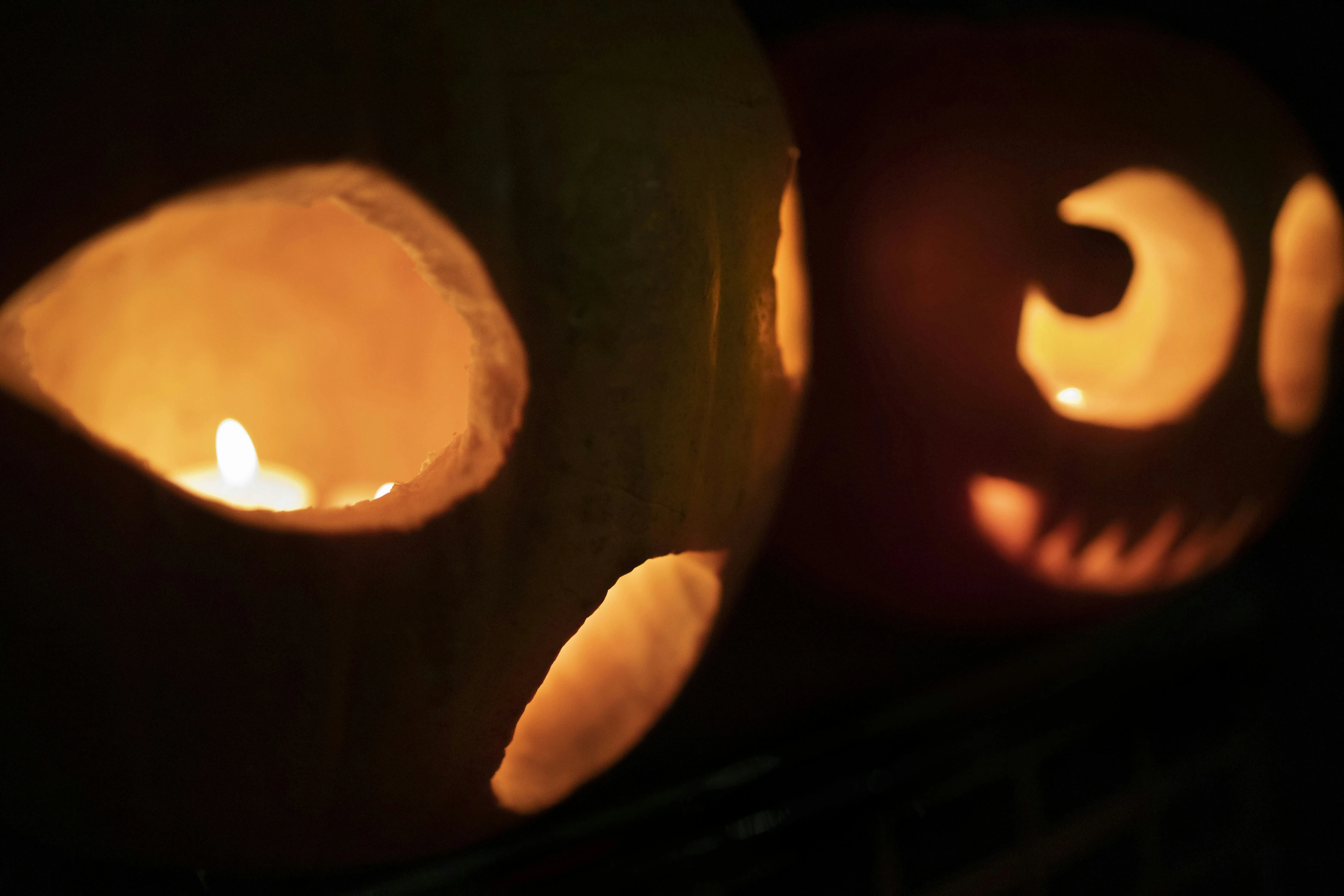 Funny Pumpkin Faces in Dim Halloween Lighting Wallpaper