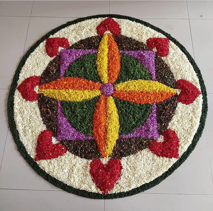 Geometric floral rangoli with heart patterns for festival