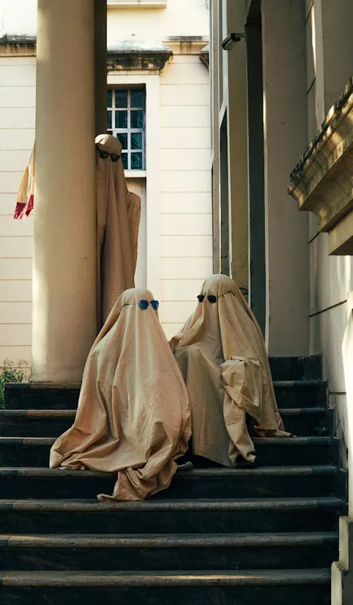 Ghost Costumes on Stairs in Halloween Parade Wallpaper