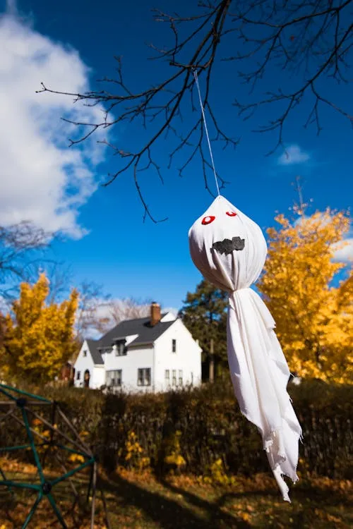 Ghost decoration hanging outside on Halloween night