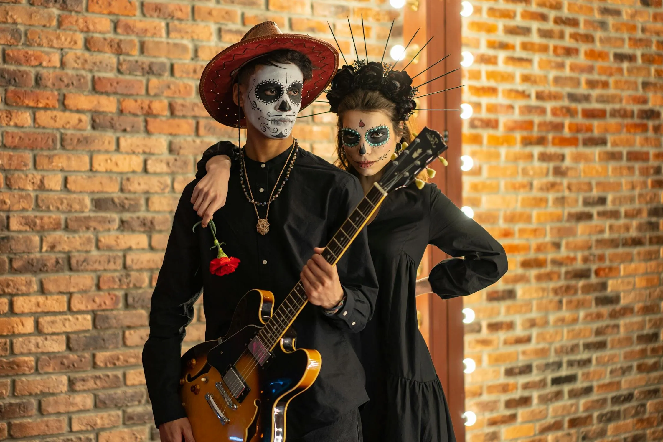 Girl and Boy in Skull Makeup Posing near Brick Wall HD