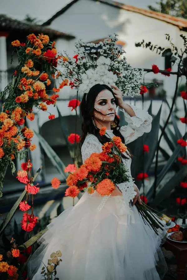 Girl dressed in a white Gown with sugar skull makeup image