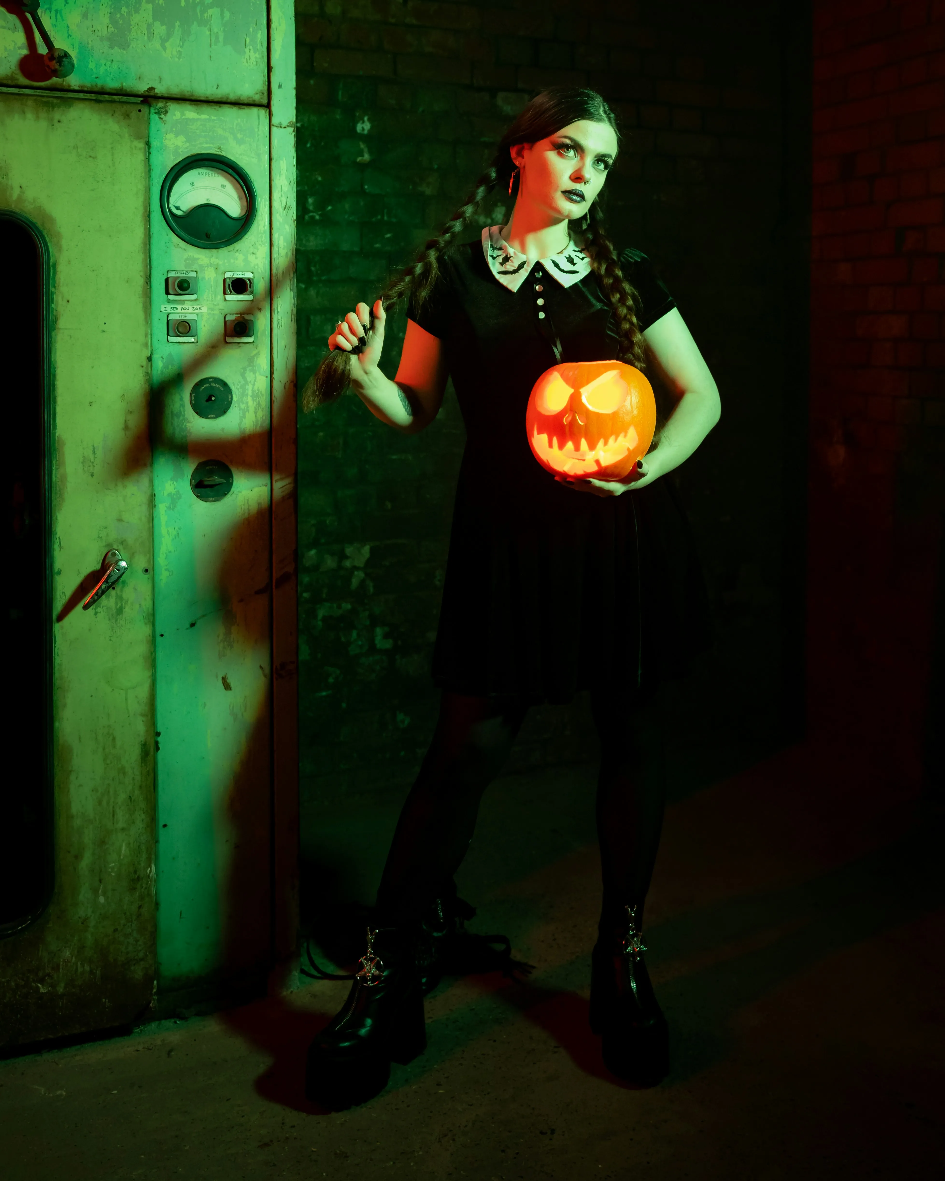 Girl Holding Halloween Pumpkin in Dark Green Room Wallpaper