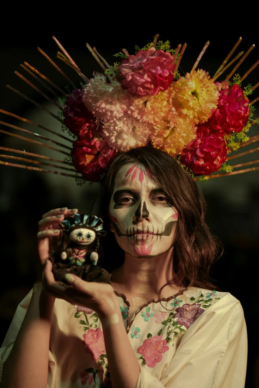 Girl in Floral Crown and Skull Makeup at Halloween Festival
