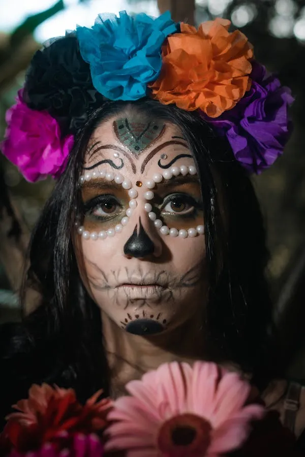 Girl with Day of the Dead makeup and colorful flower headband