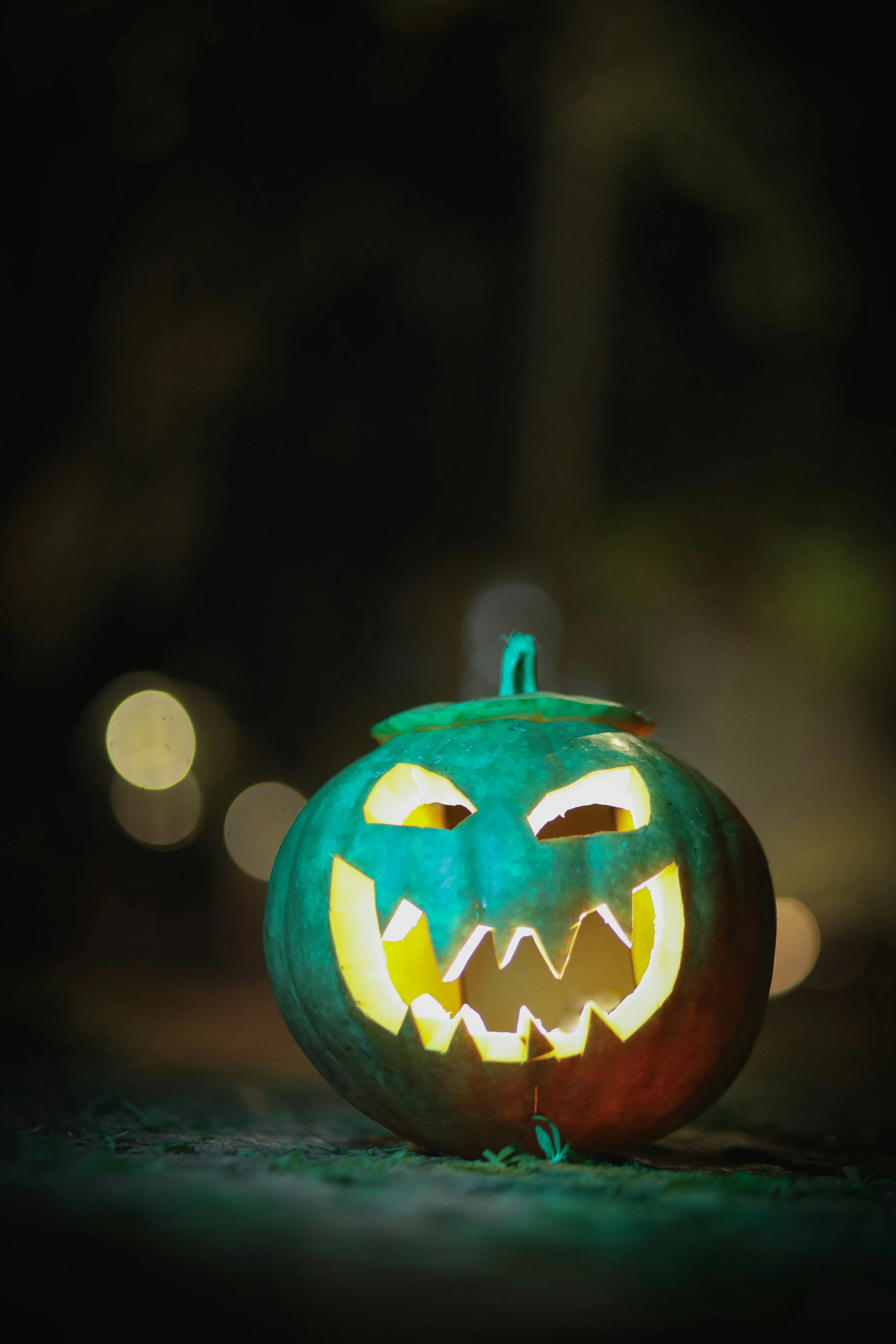 Glowing Blue Halloween Pumpkin with Scary Face Image
