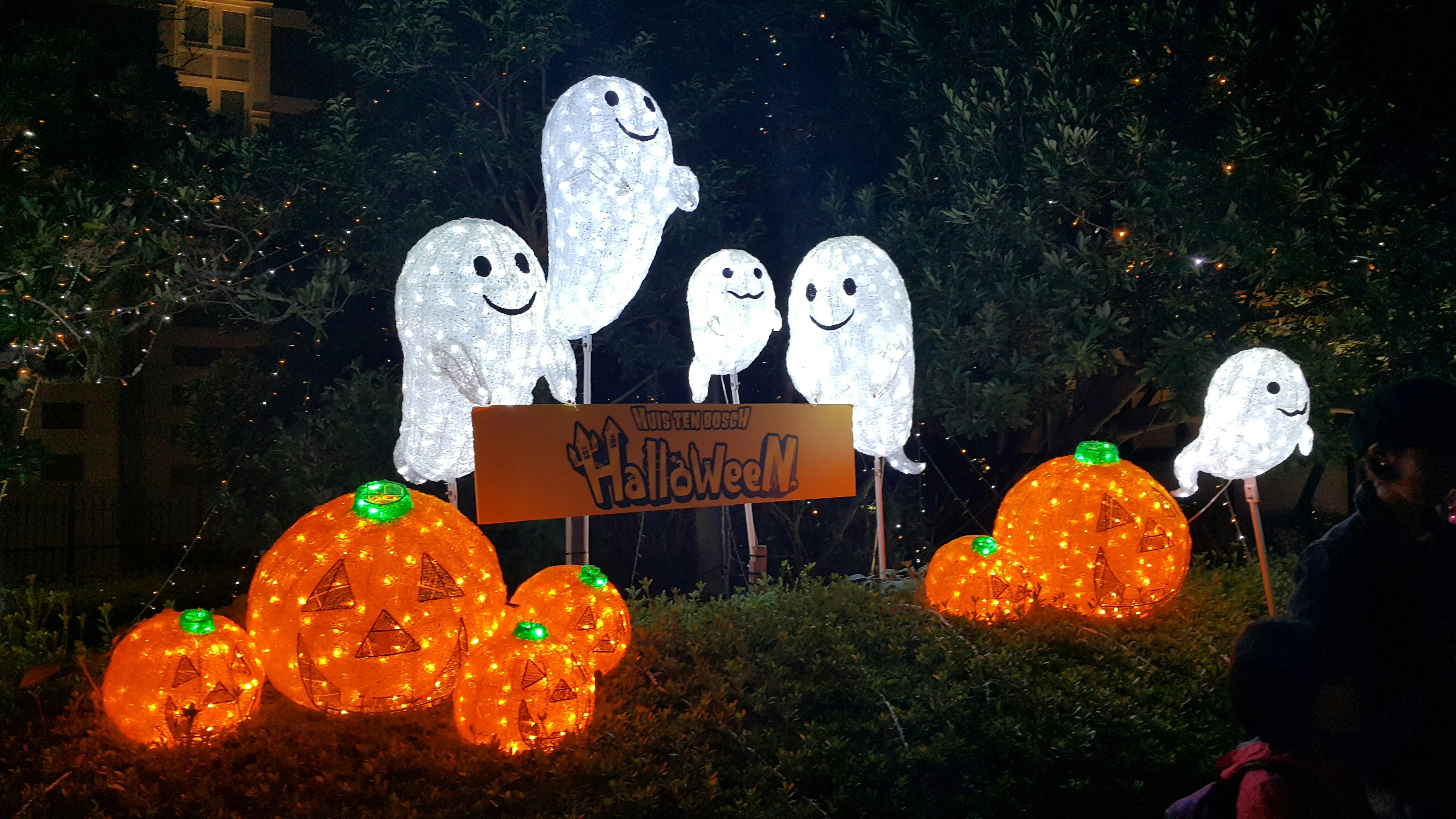 Glowing Ghosts and Pumpkins on Spooky Halloween Lawn Image