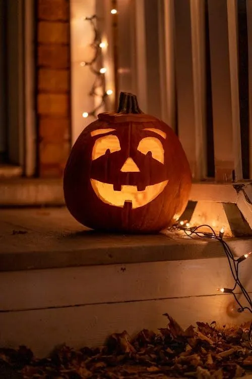 Glowing Jack O Lantern on Porch at Night HD Wallpaper