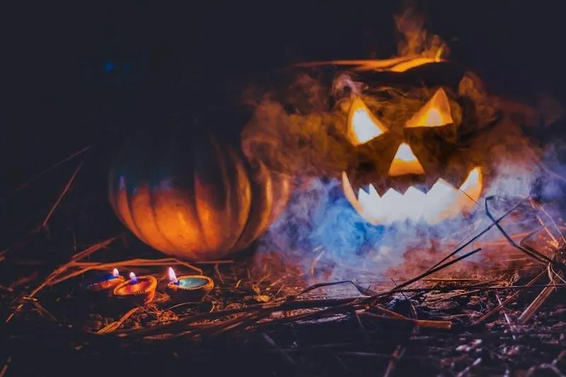 Glowing Jack O Lanterns with Fog in Spooky Night Wallpaper