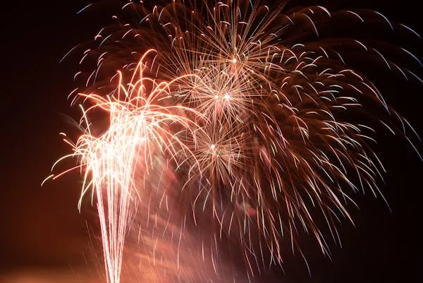 Golden and Red Fireworks Lighting up the Evening Sky