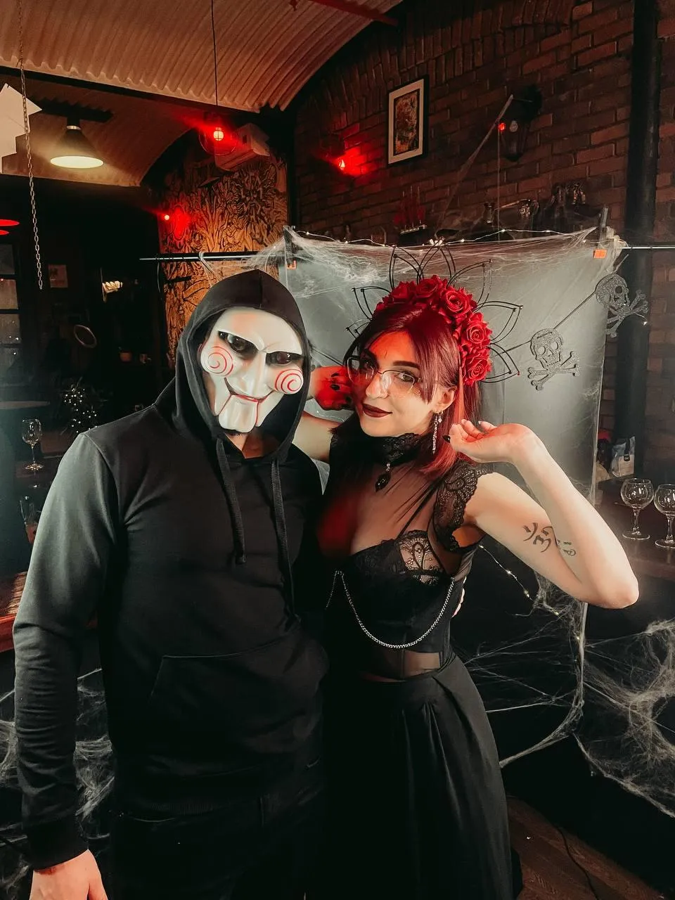 Gothic Couple in Mask and Red Themed Outfit HD image