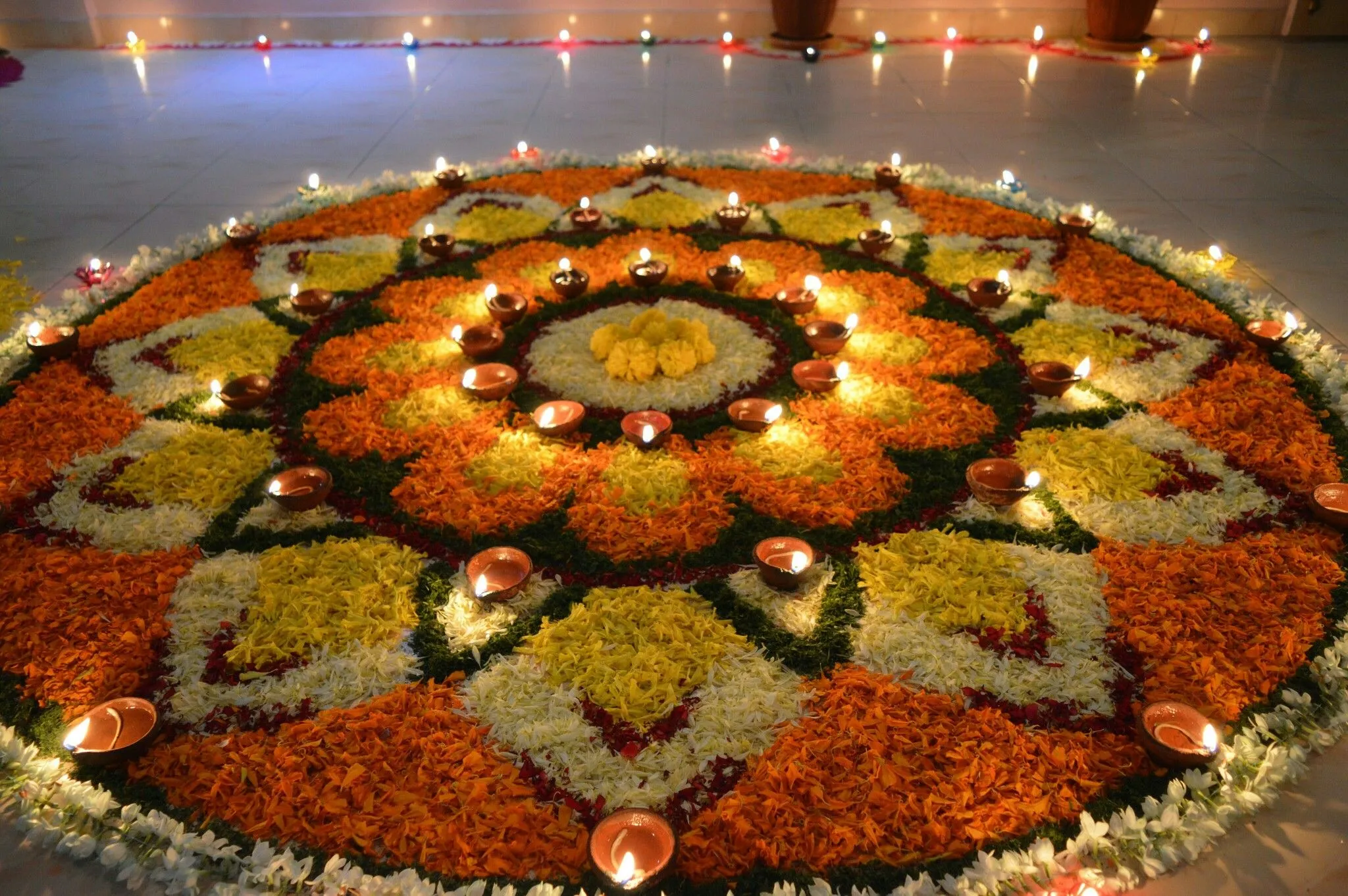 Grand circular rangoli with glowing oil Lamps Wallpaper