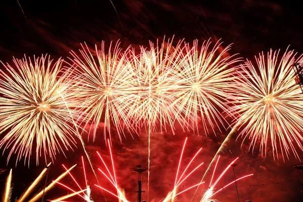 Grand Fireworks Display with Multiple Red Explosions