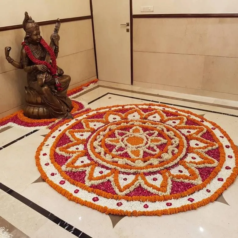 Grand floral rangoli design for Pooja room Decoration image