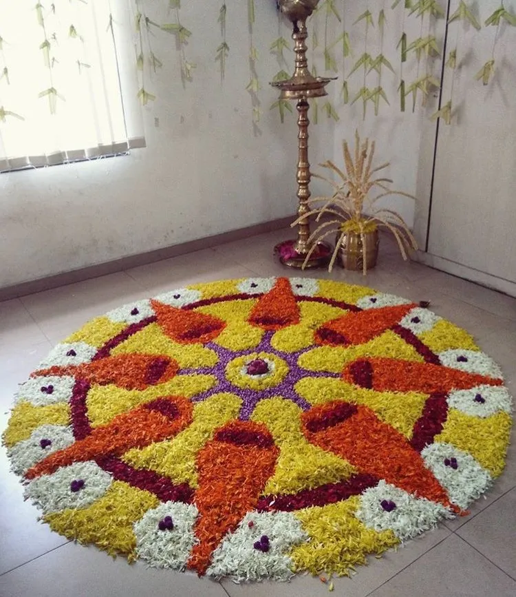 Grand Onam rangooli design with radiating petal design image