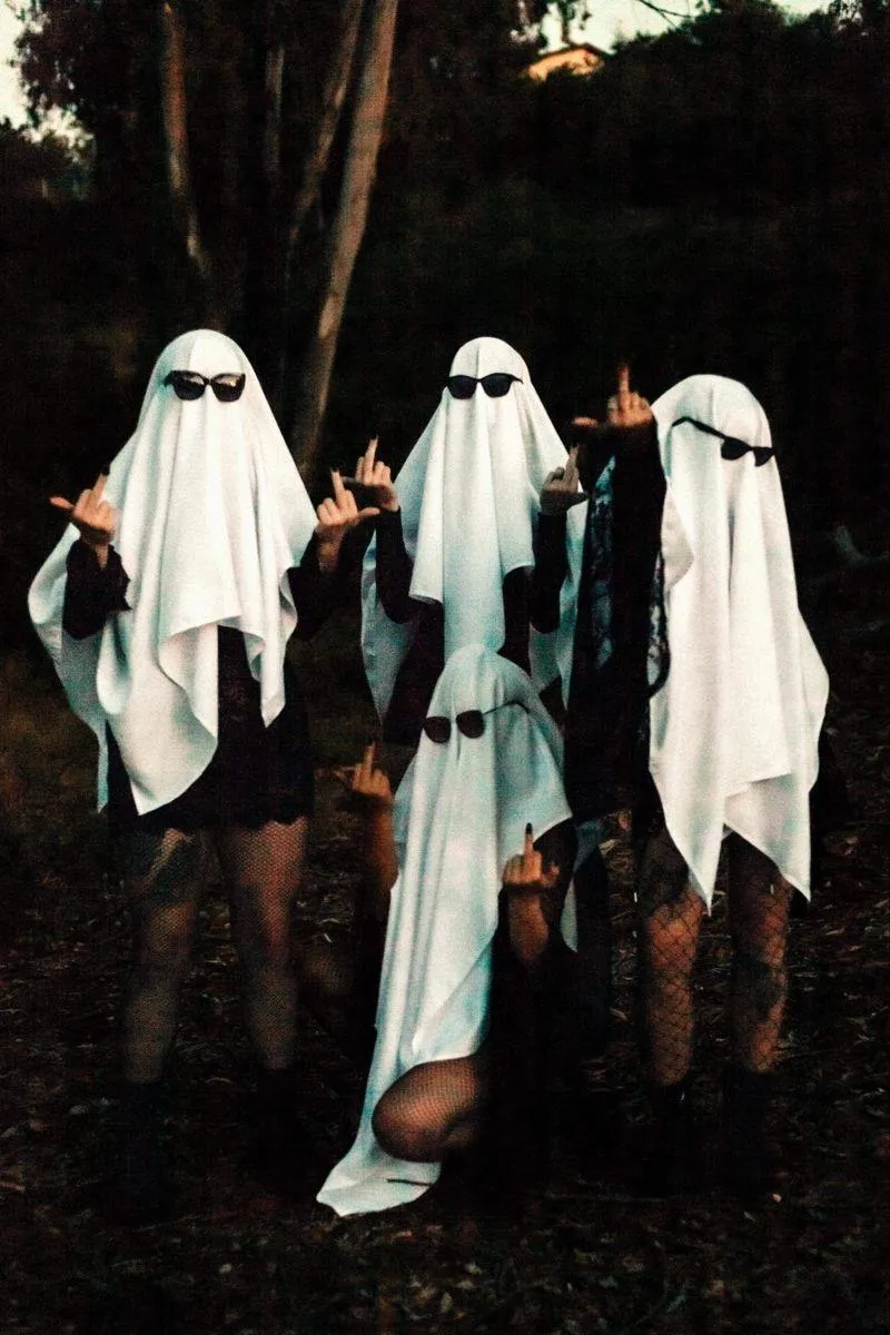 Group of Friends Dressed as Ghosts for Halloween Festival