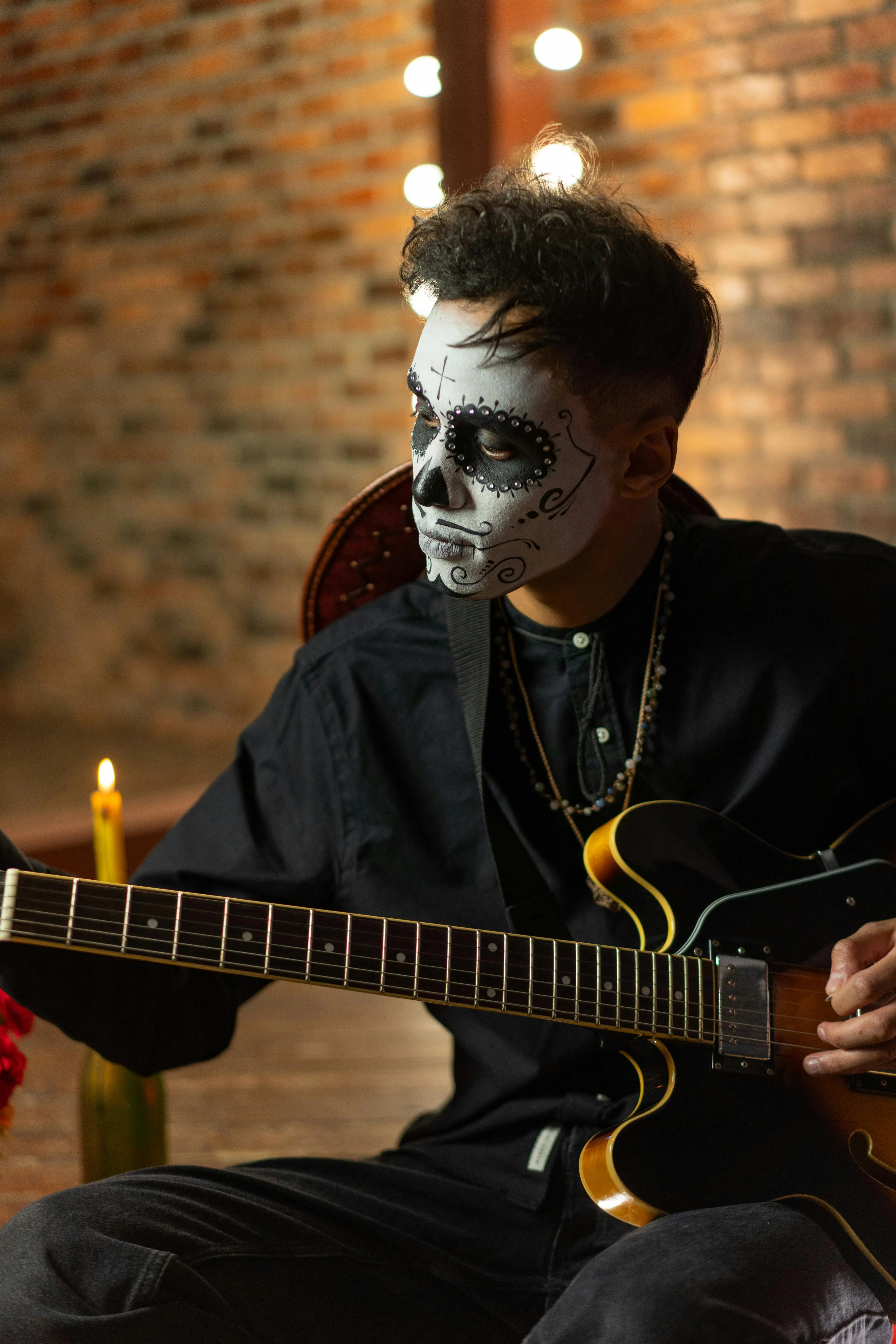 Guitarist in Skeleton Makeup Playing at Halloween Wallpaper