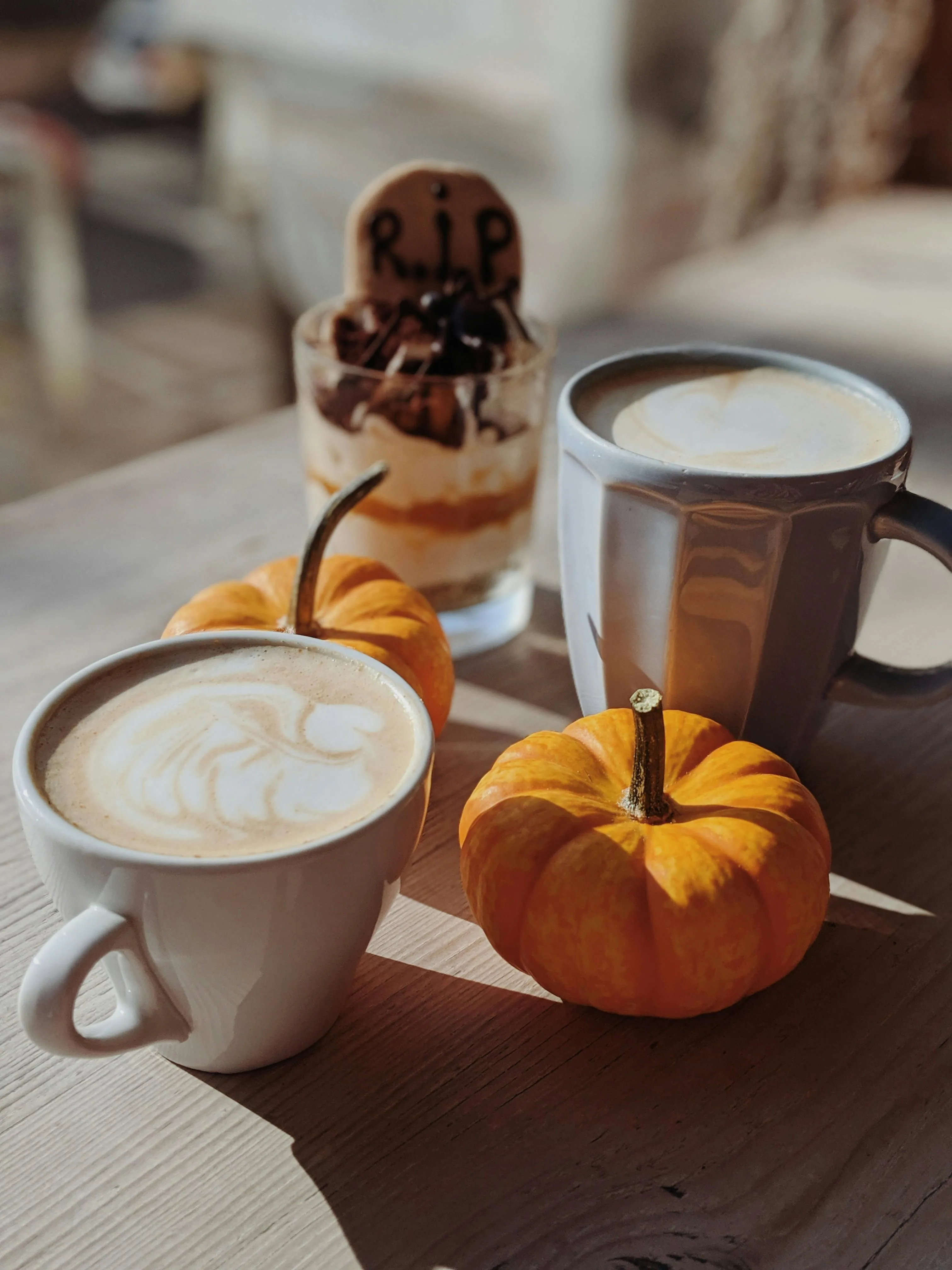 Halloween Coffee Table with Pumpkin and Hot Drinks