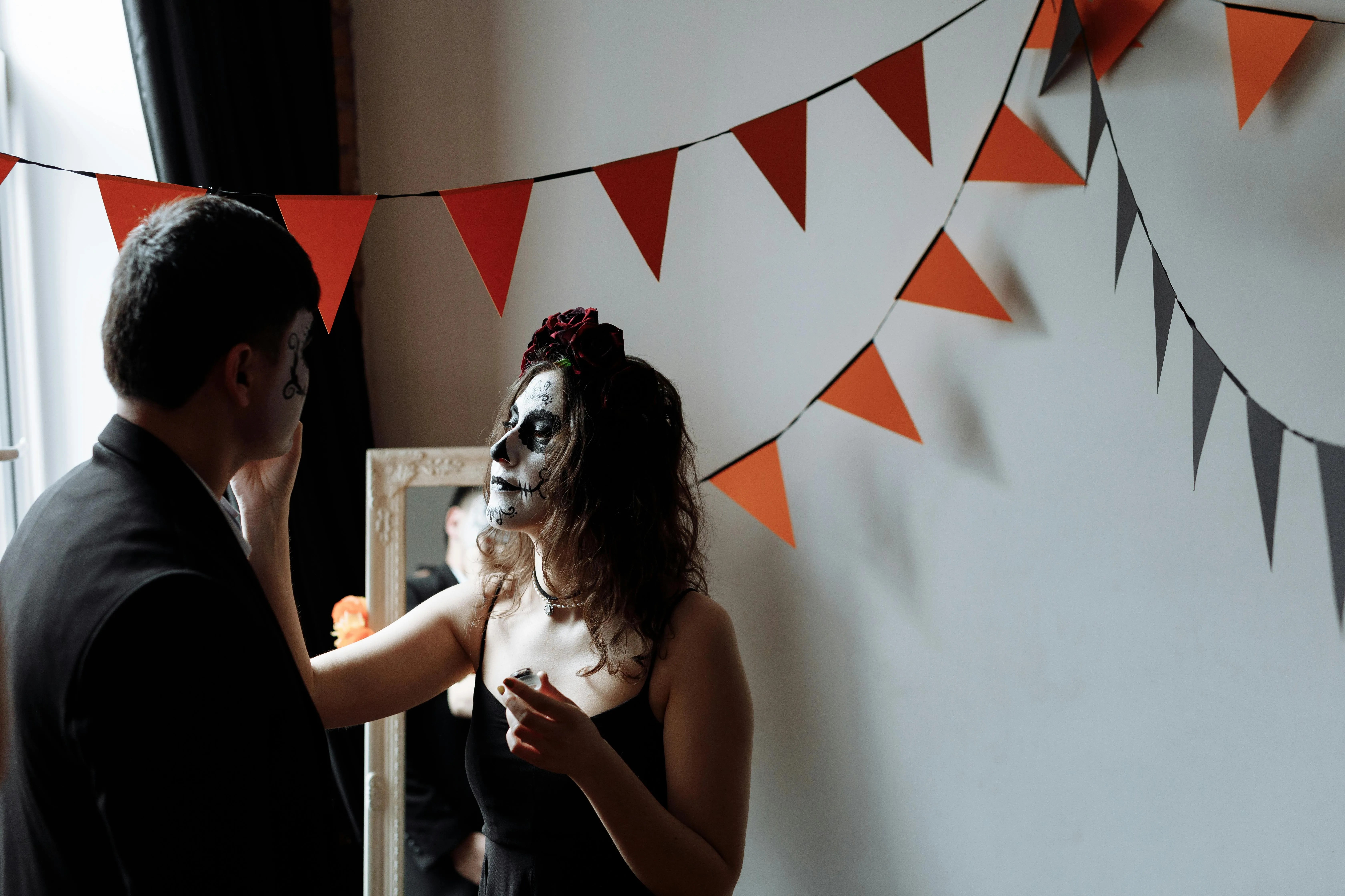 Halloween Couple Preparing for a Spooky Celebration