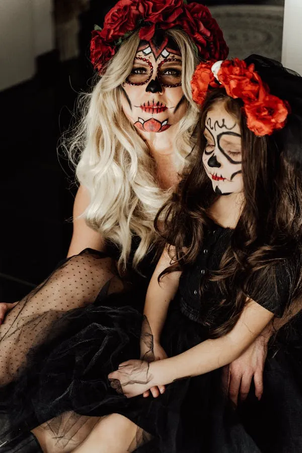 Halloween Couple with Matching Face Paint and Flowers