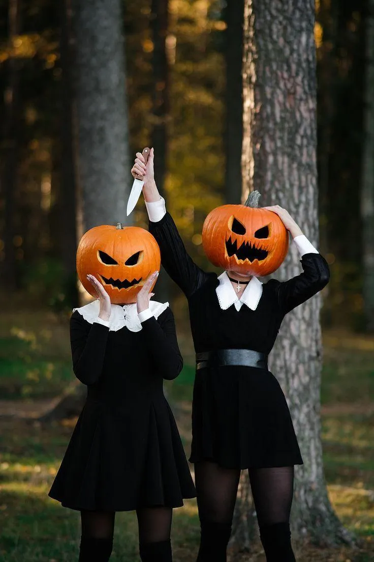 Halloween Dance Duo with Pumpkin Heads in Matching Outfits