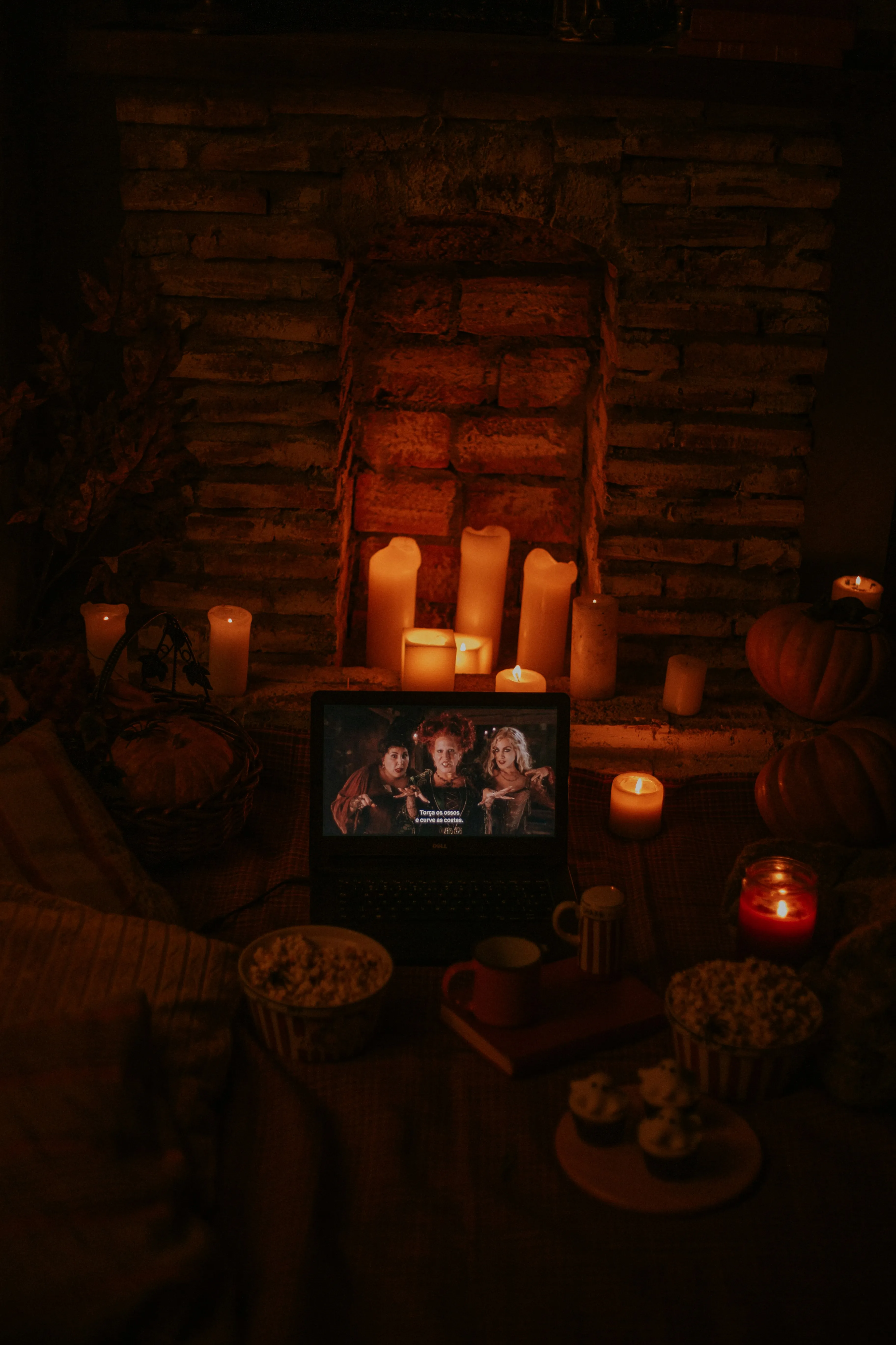 Halloween Feast Table with Pumpkins and Candles Wallpaper