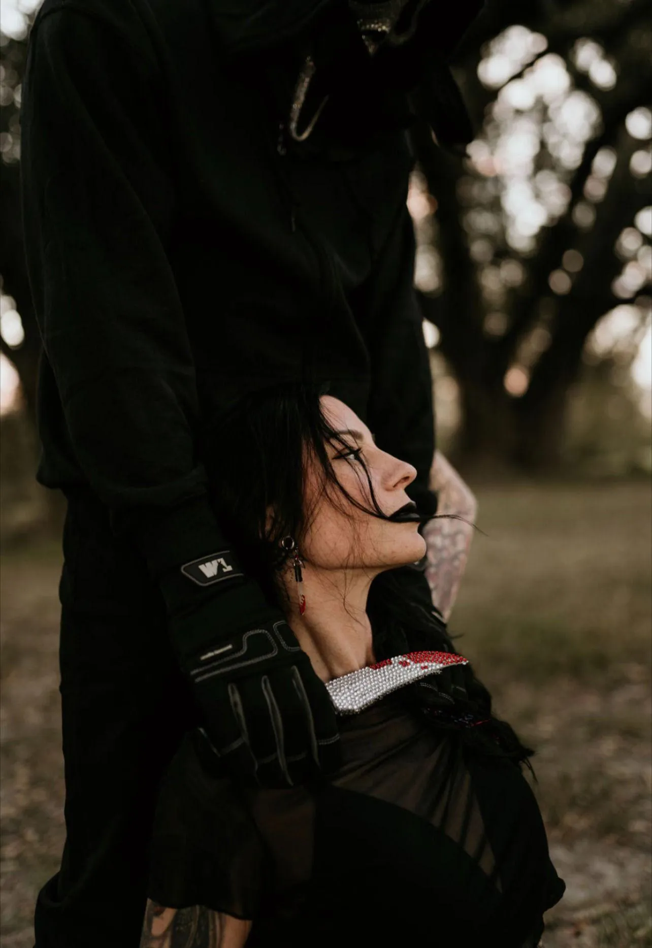 Halloween Festival Couple in Dark Costume Embrace Wallpaper