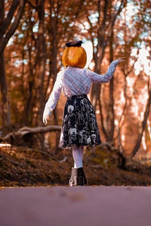 Halloween Festival Girl with Pumpkin Mask Outdoors image