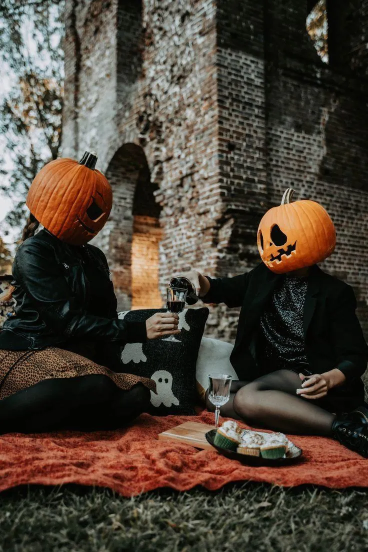 Halloween Festival with Pumpkin Heads Enjoying Picnic