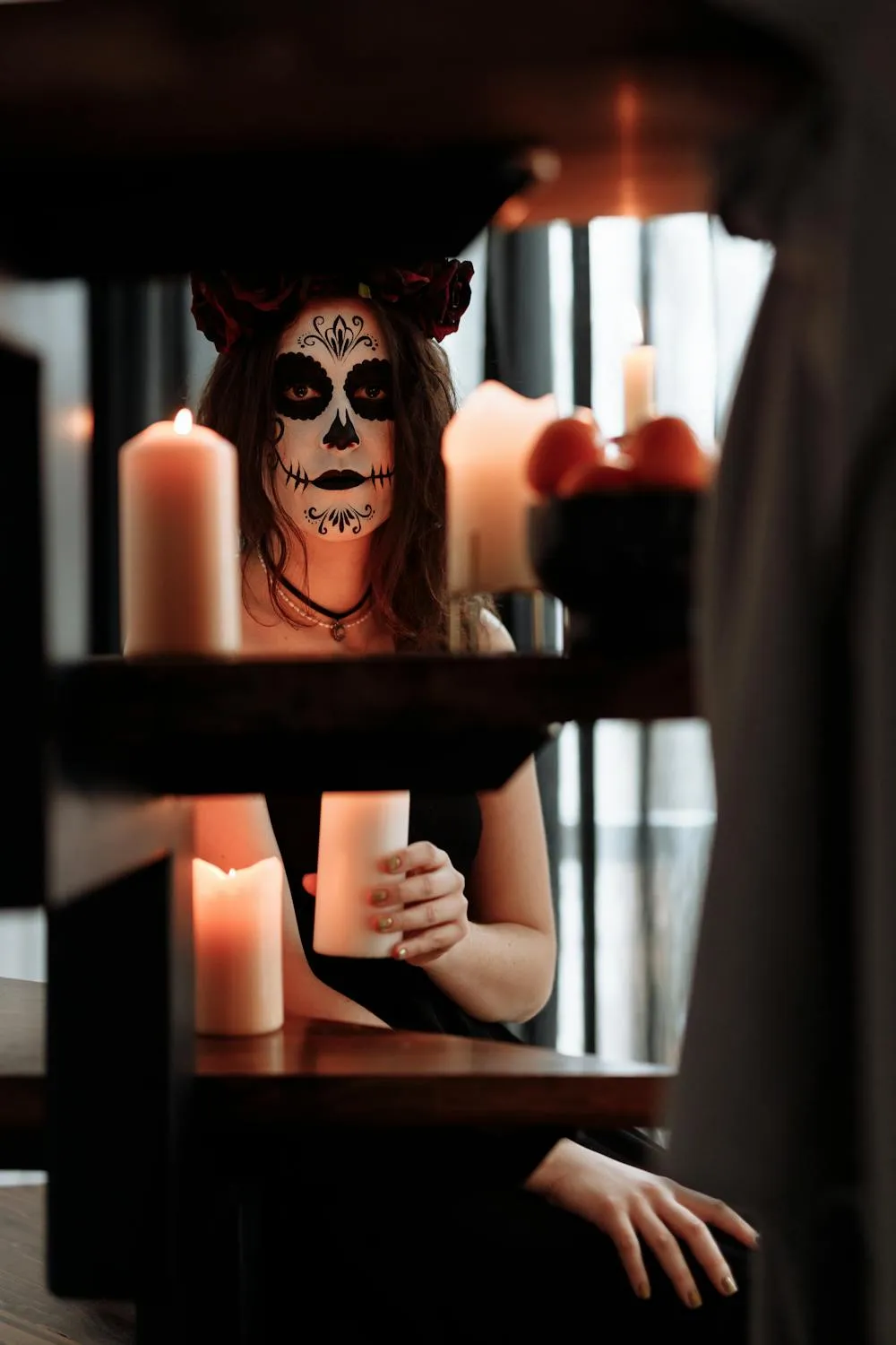 Halloween Makeup Artist Holding Candle in Dark Room