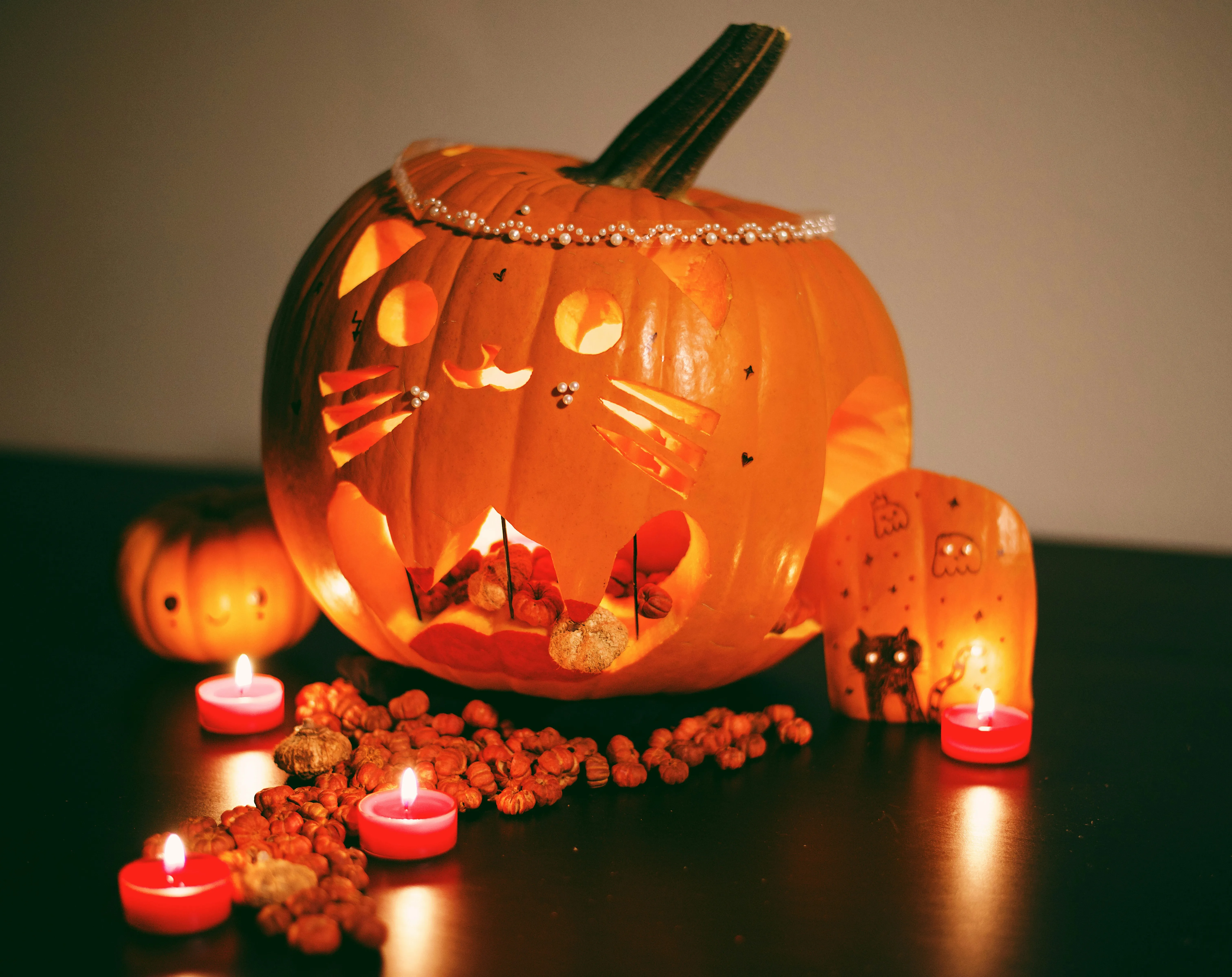 Halloween Pumpkin Display with Candlelight Ambience Image