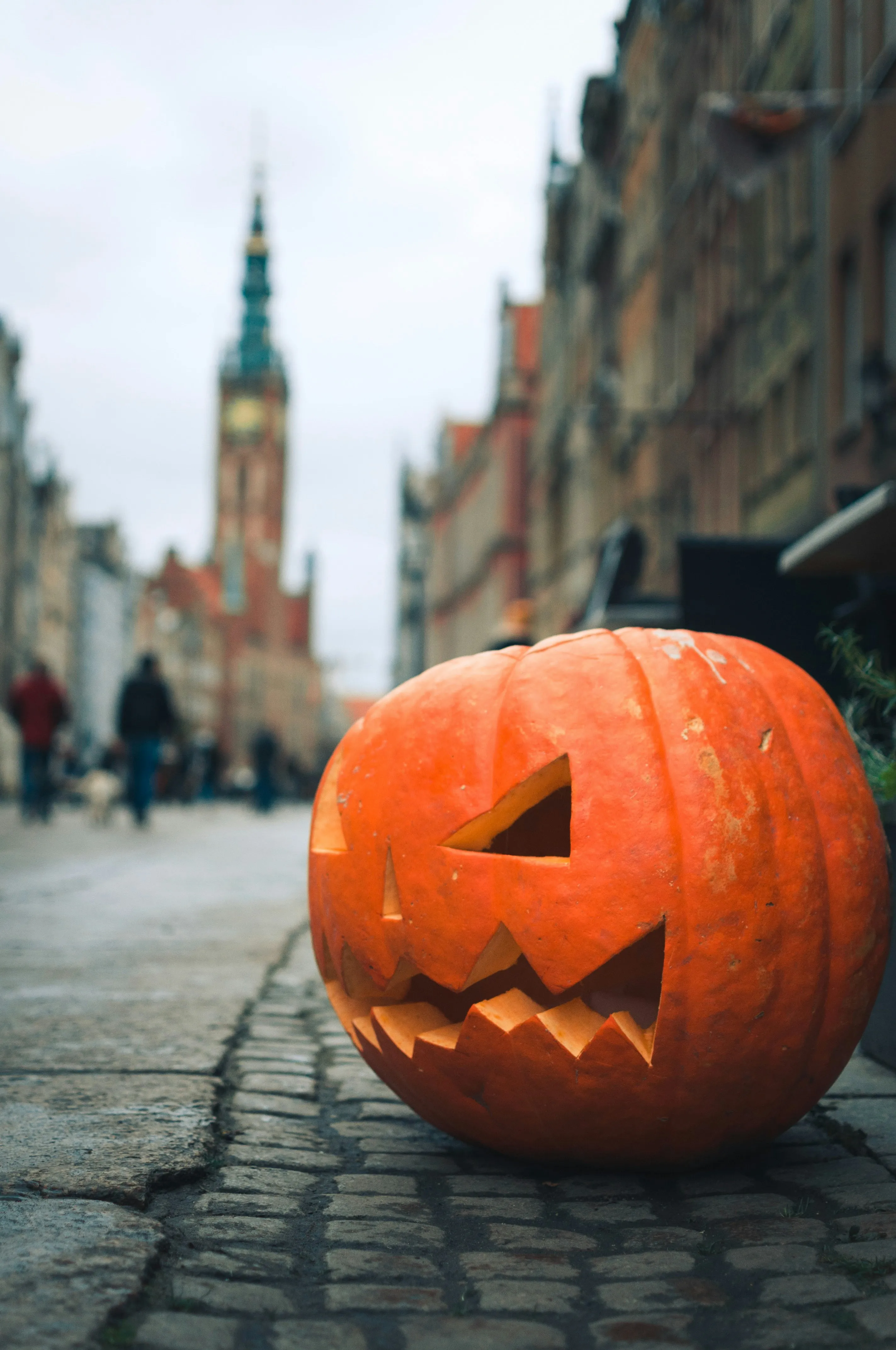 Halloween Pumpkin Displayed on Urban Street Wallpaper