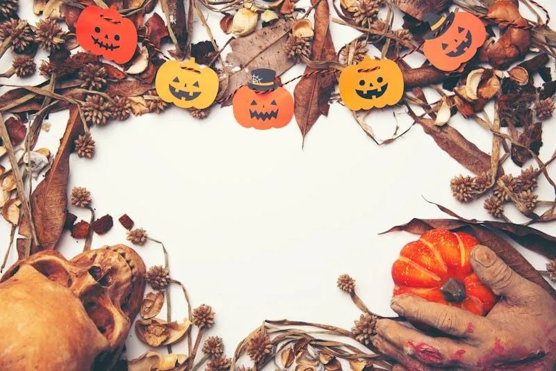 Halloween Pumpkin Garland with Autumn Leaves and Blank Space