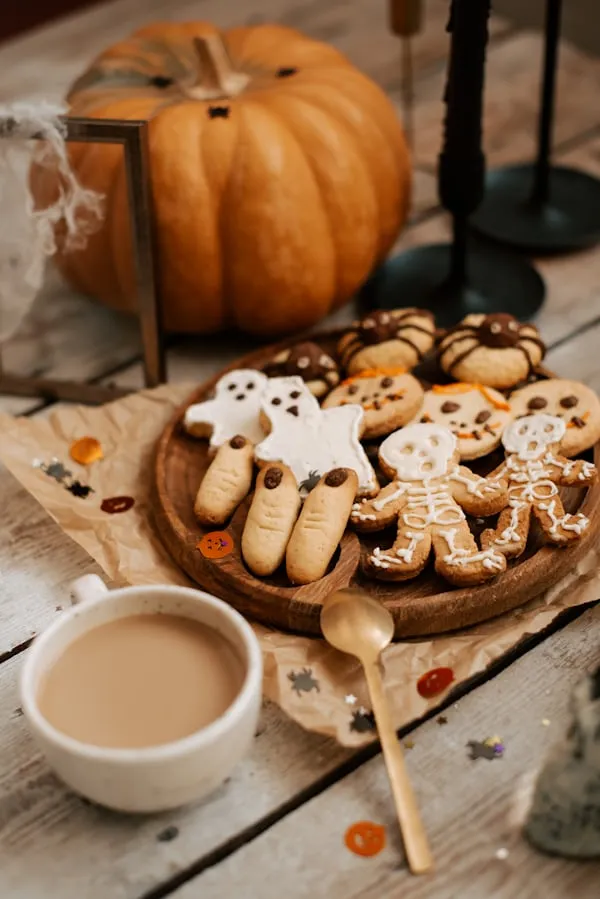 Halloween Treats and Hot Beverage on Cozy Autumn Table