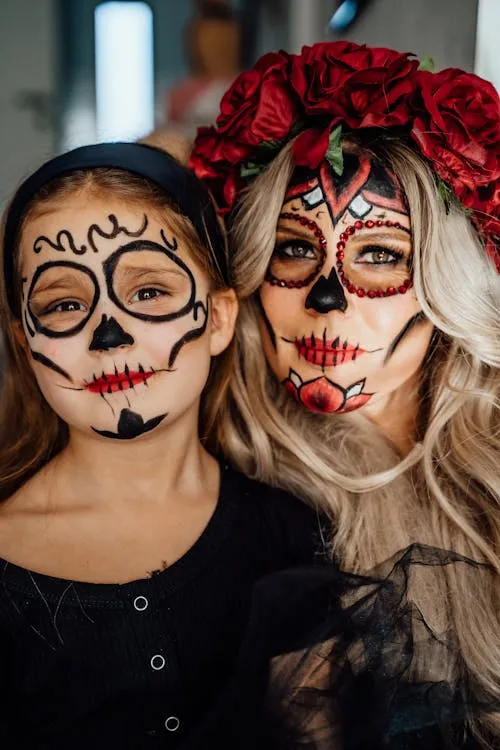 Halloween women and kid wearing floral skull makeup
