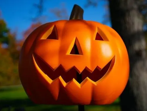 Happy Halloween Pumpkin with Triangular Eyes Outdoors