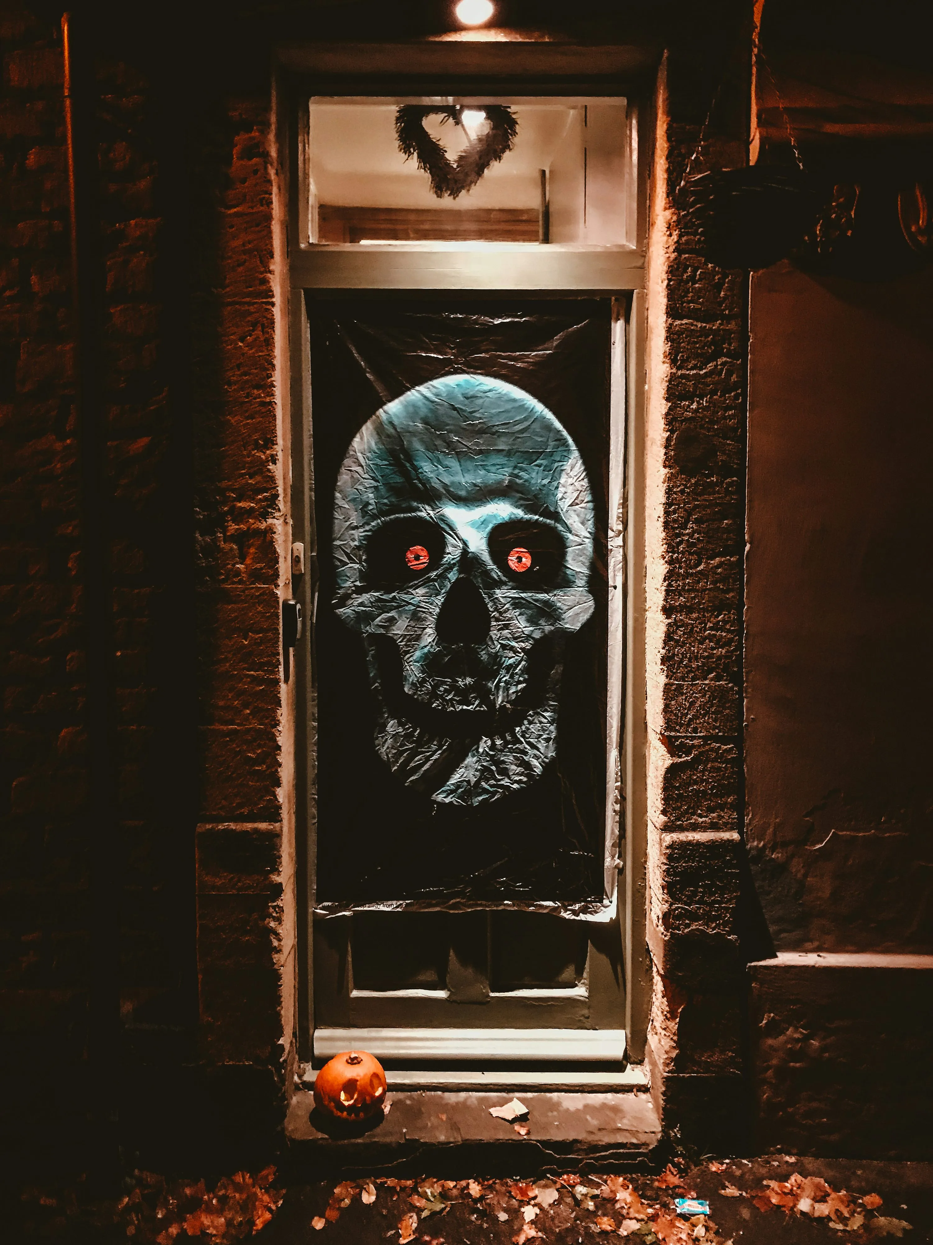 Haunted House Door with Scary Skull Decoration Wallpaper
