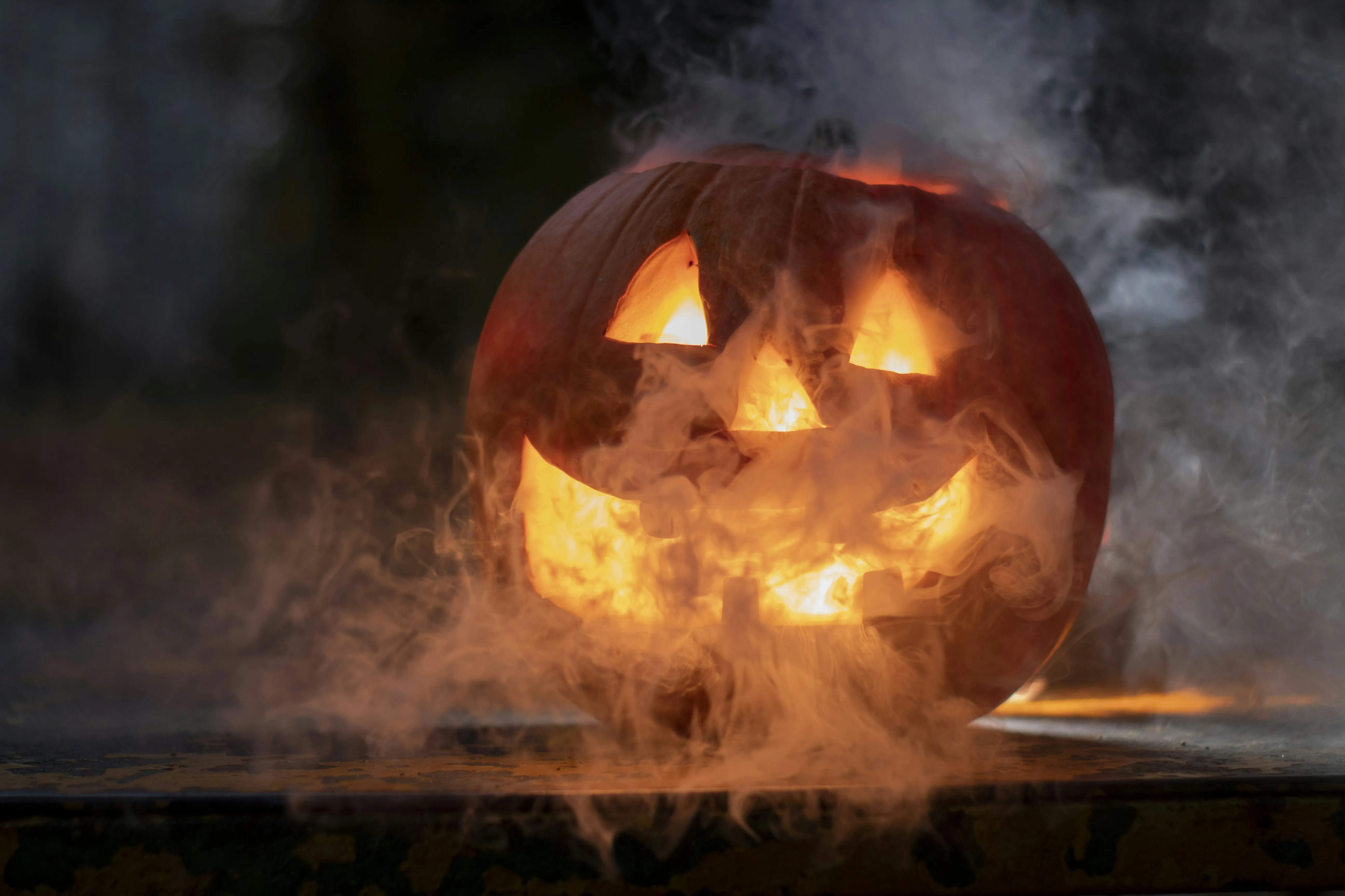 Jack O Lantern Glowing Through Halloween Fog Wallpaper