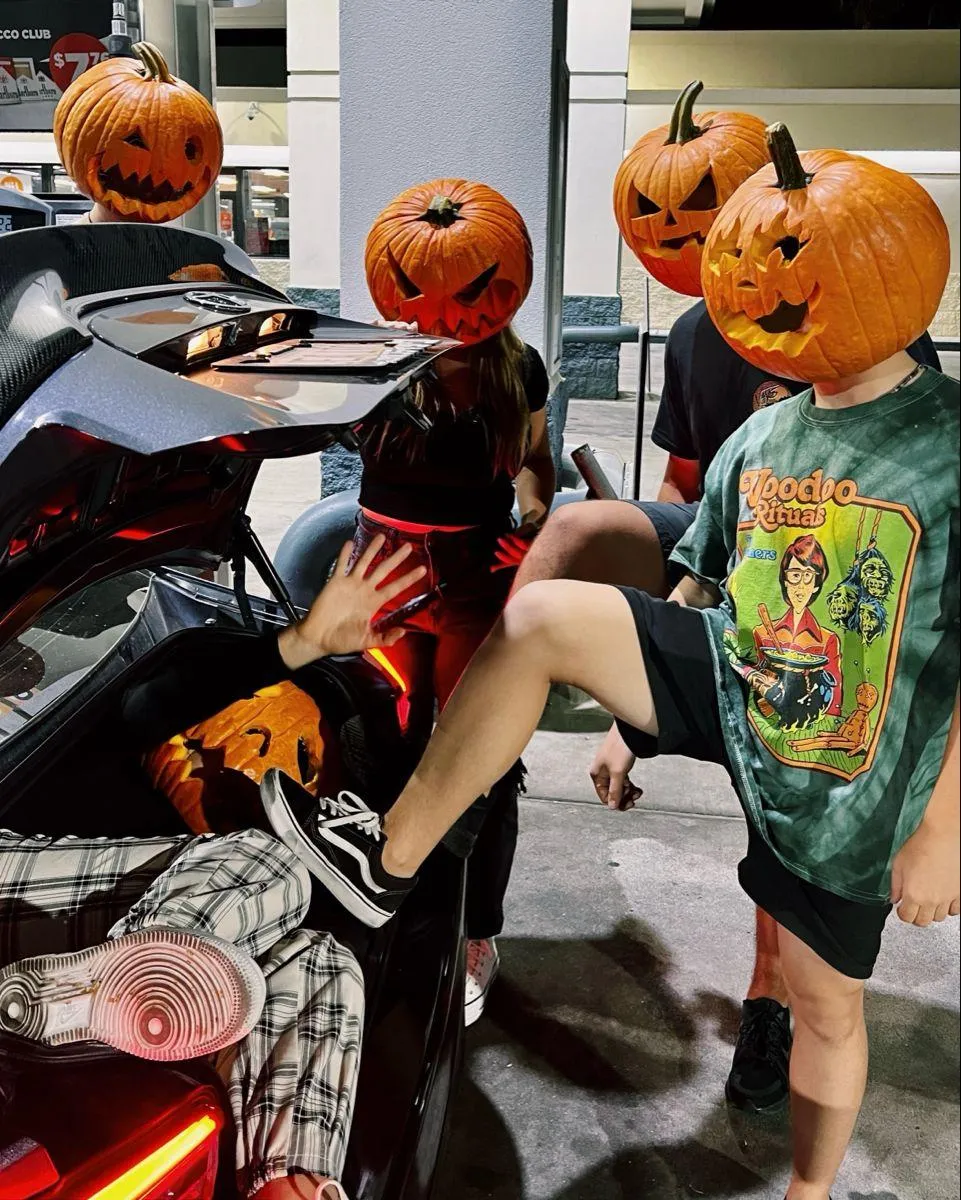 Kids Halloween Fun Pumpkin Heads and Bikes Outdoors