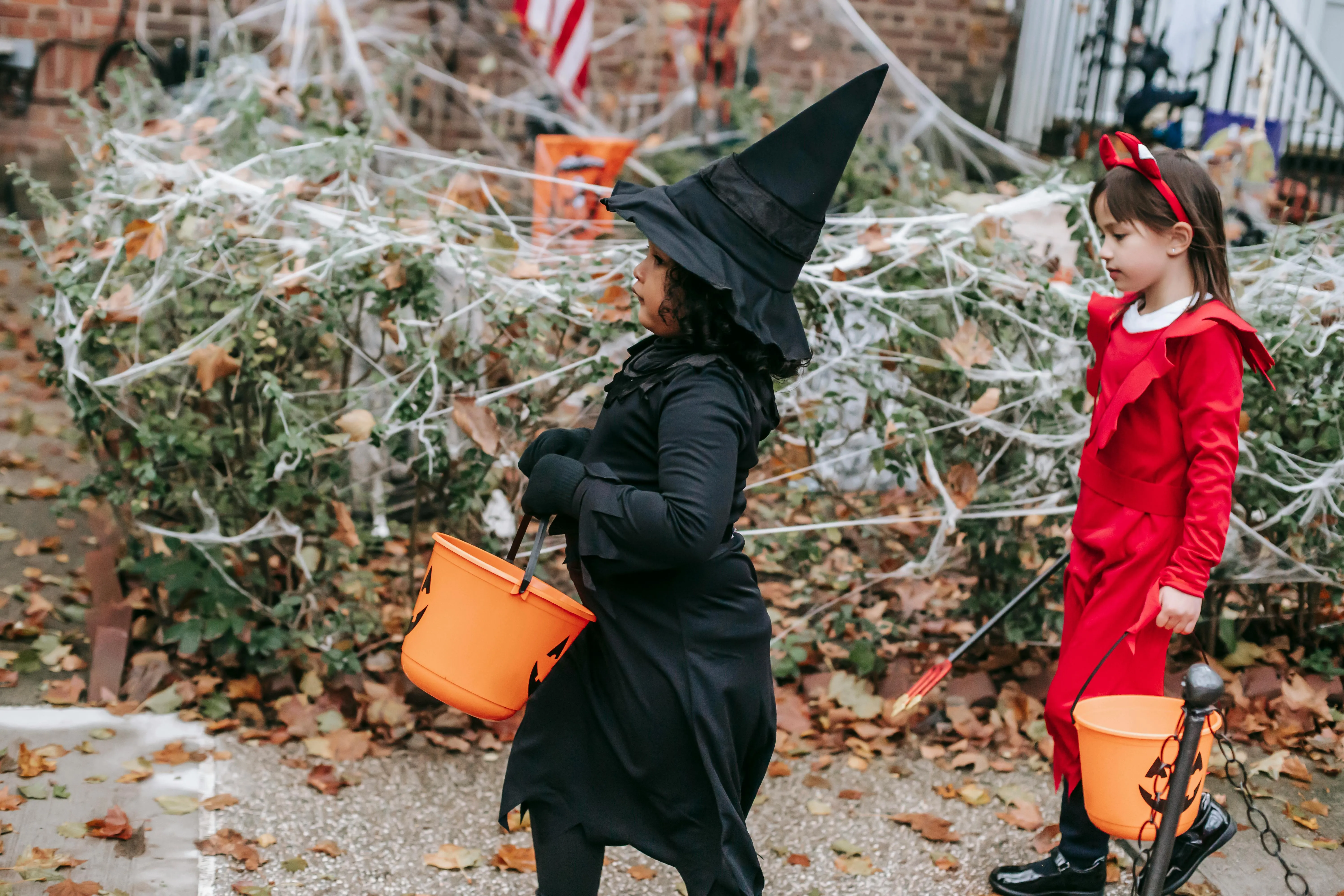 Kids Trick or Treating in Witch and Red Dress Costume