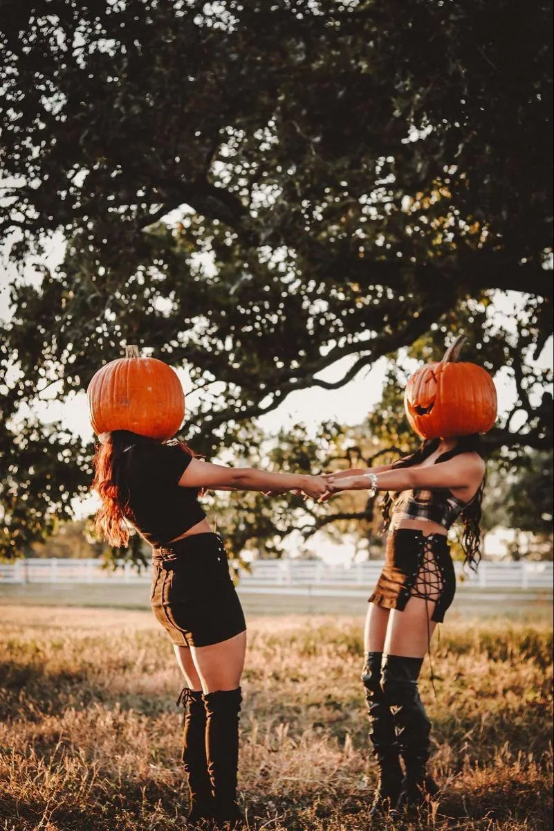 Kids with Pumpkin Heads Playing in Autumn Park Wallpaper