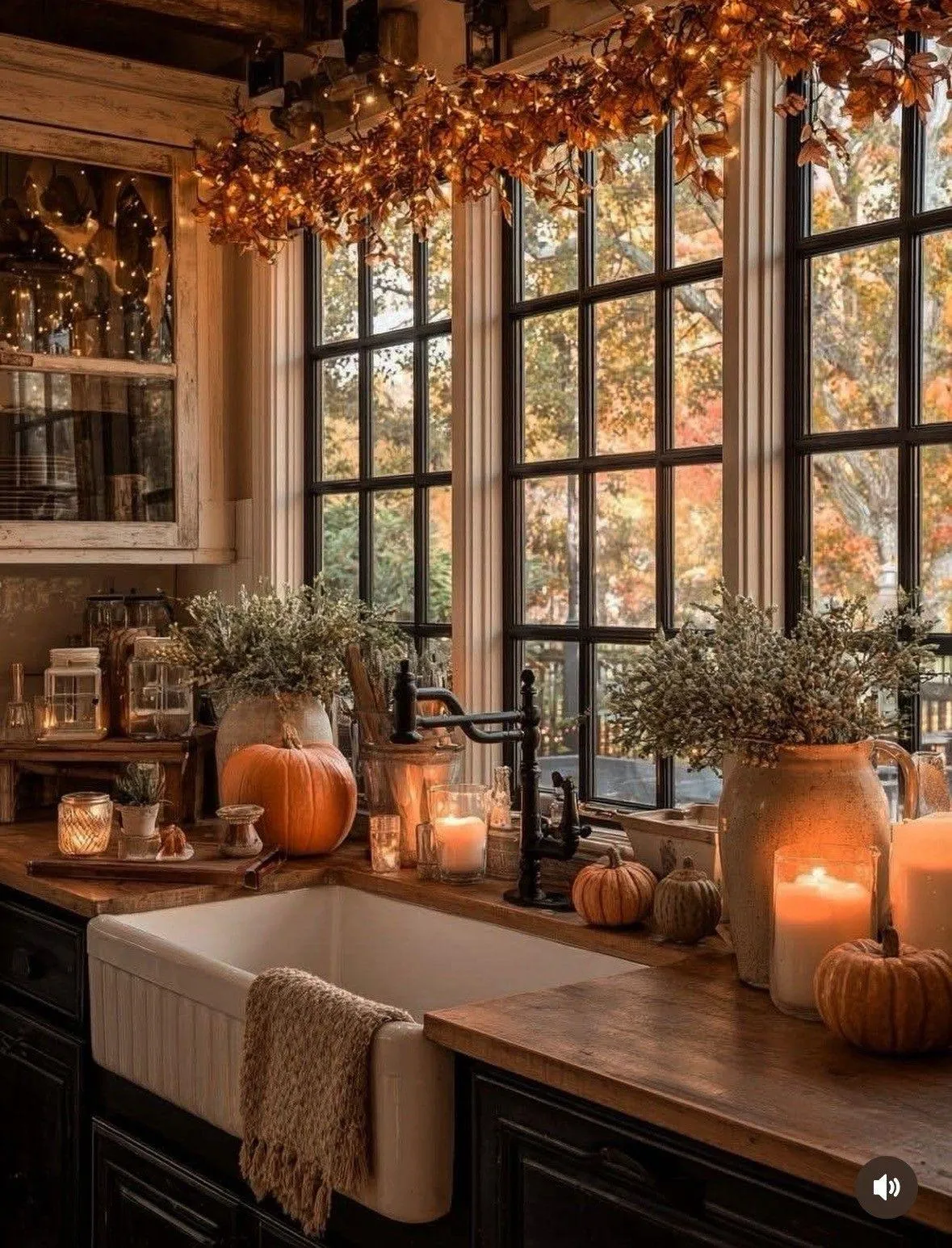 Kitchen Window Lit with Halloween Candles and Pumpkins