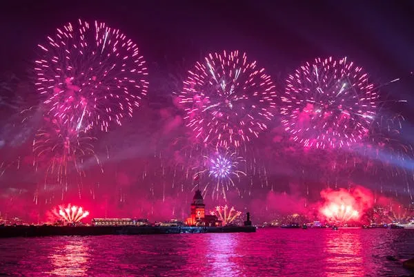Large scale fireworks event over water captured by specialists