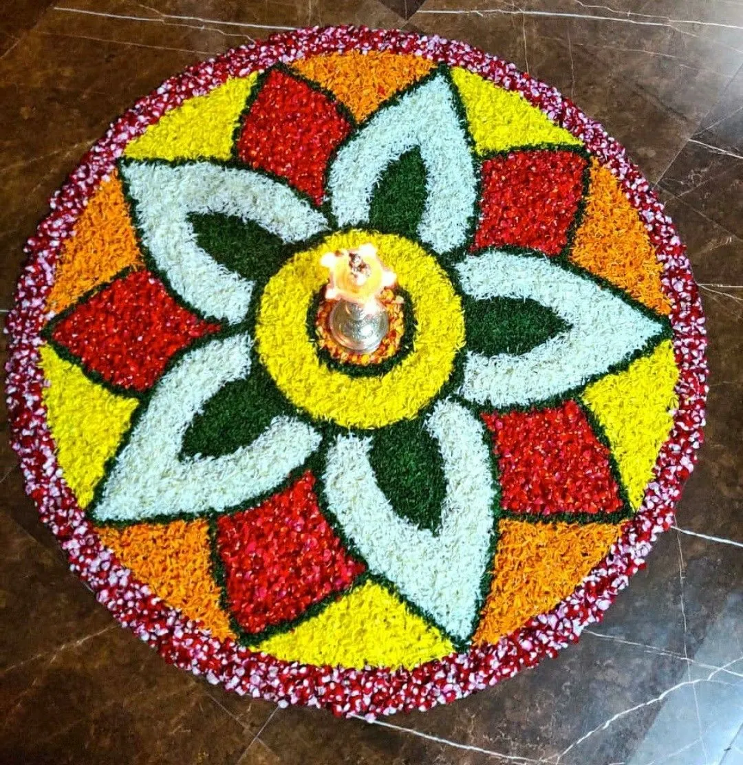 Layered floral pookolam with purple and white petal border
