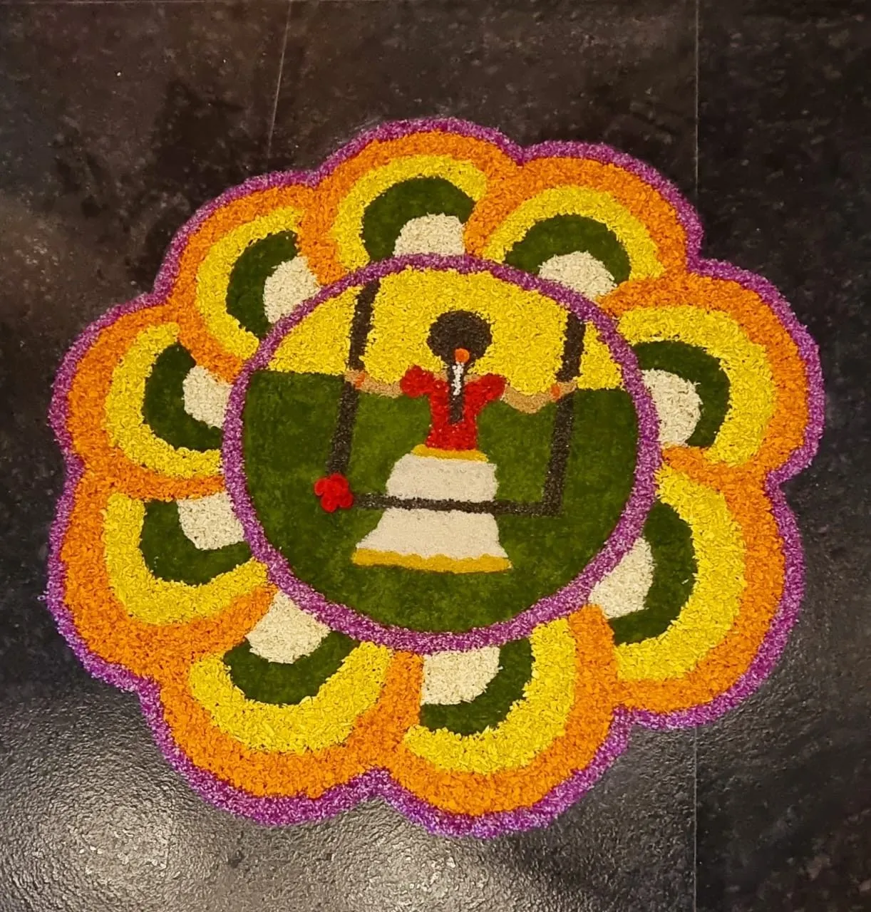 Layered flower Pookolam with a girl swinging design image