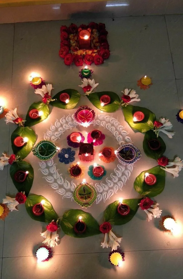Leaf and diya rangoli with flowers and white Patterns image