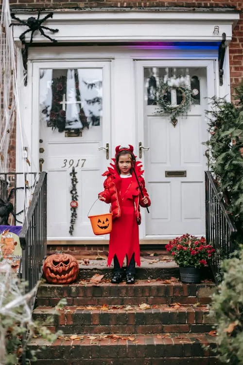 Little Girl in Red Dress with Pumpkin Halloween Theme