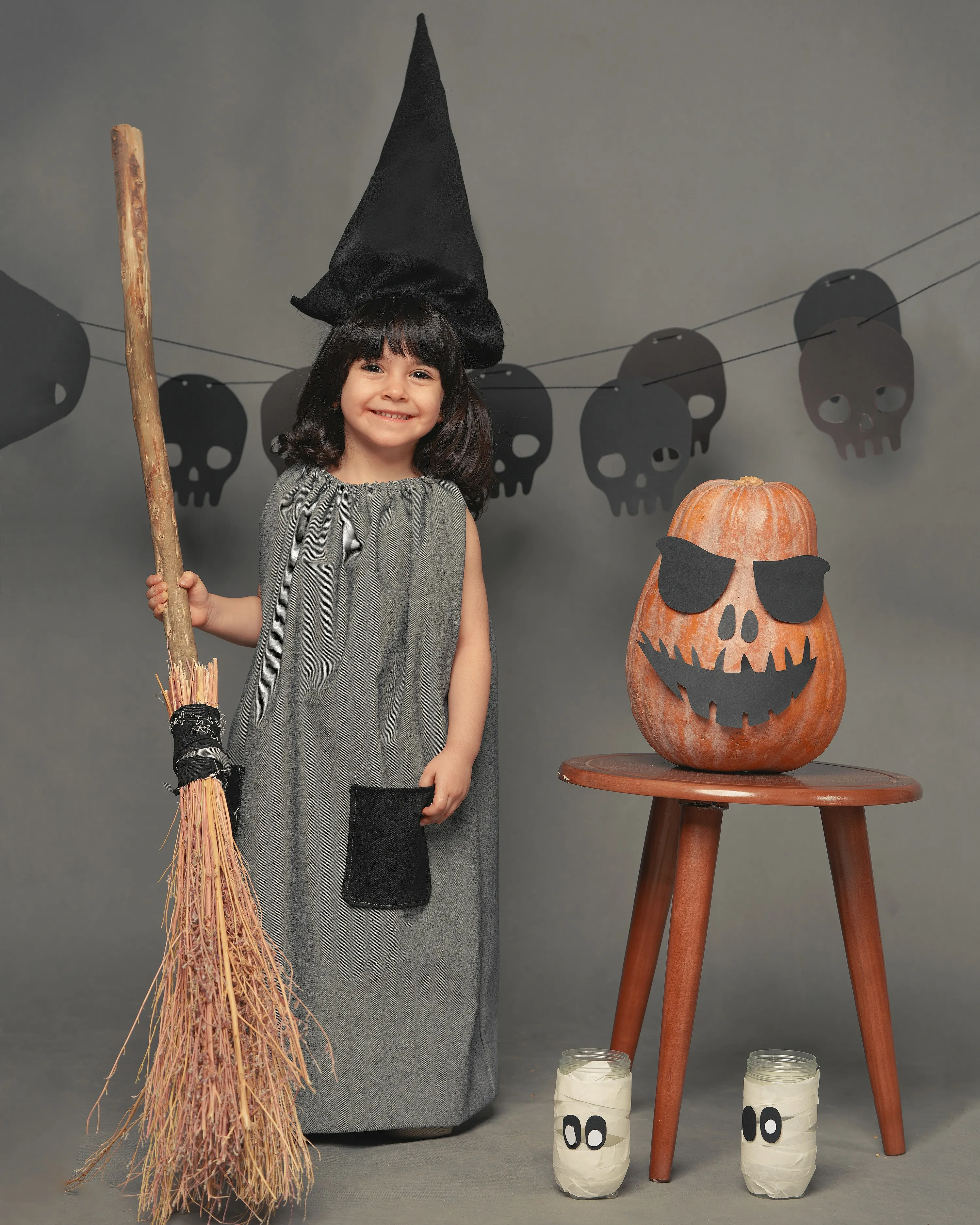 Little Witch Costume with Pumpkin and Broomstick Wallpaper