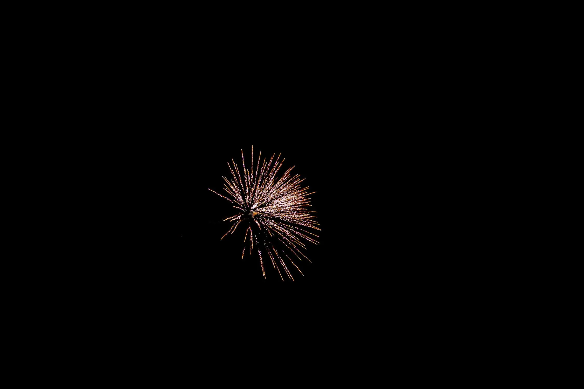 Long Trail of Fireworks Fading into the Night Sky image