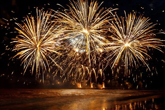 Majestic Beautiful Fireworks Display over the Water at Night